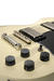 This Washburn comes with aged Gibson-ish fittings.
